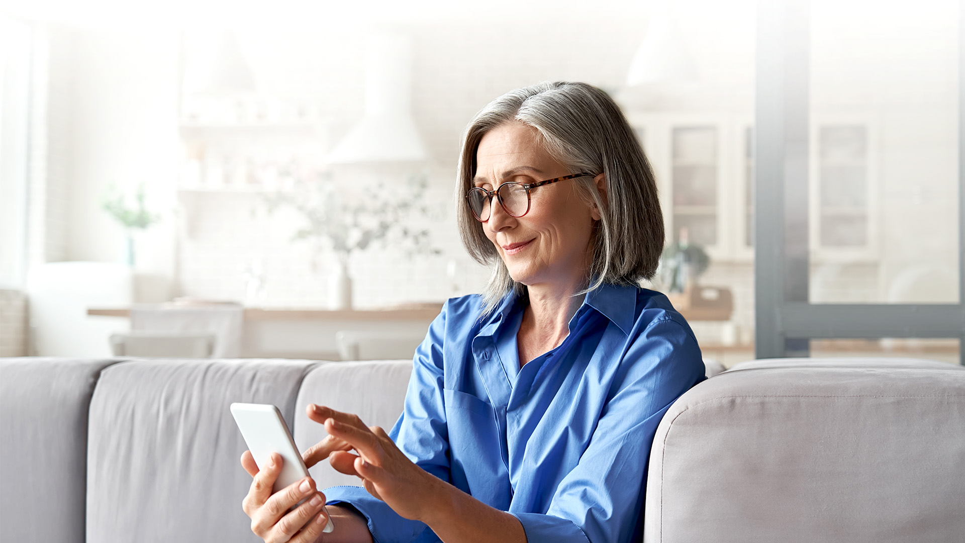 Senior woman looking at smartphone